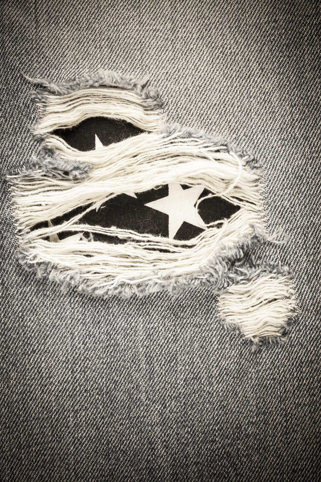 Monochrome embroidered patch on denim